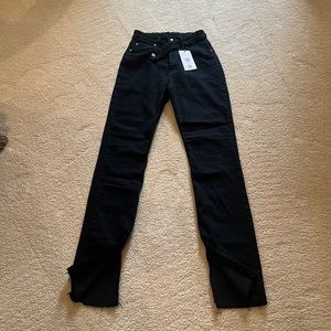 Piral brand: High rise flare jeans with diagonal button and slit on each leg